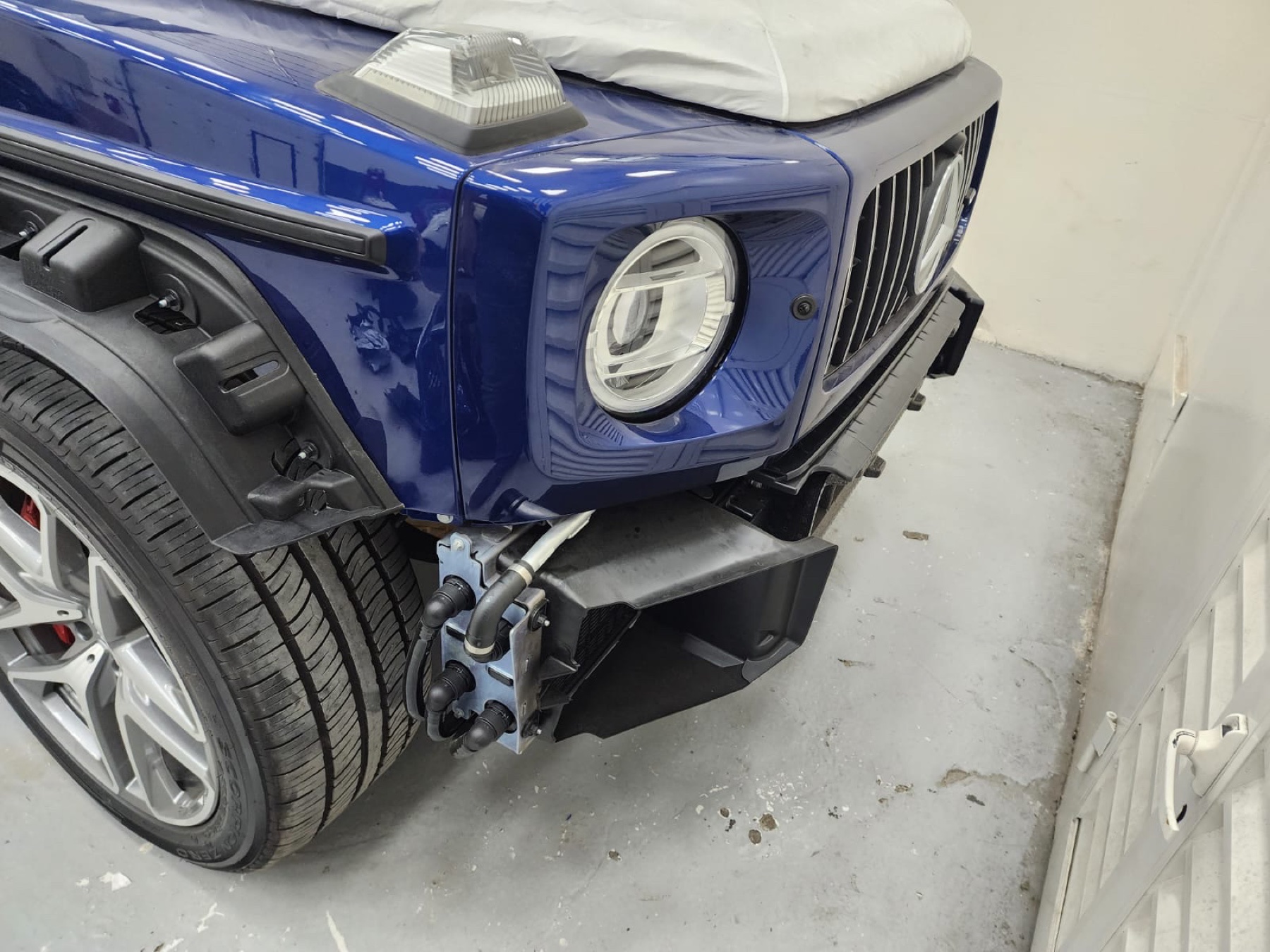 Mercedes-AMG G63 front corner prepared for BRABUS G 800-style body conversion in Dubai