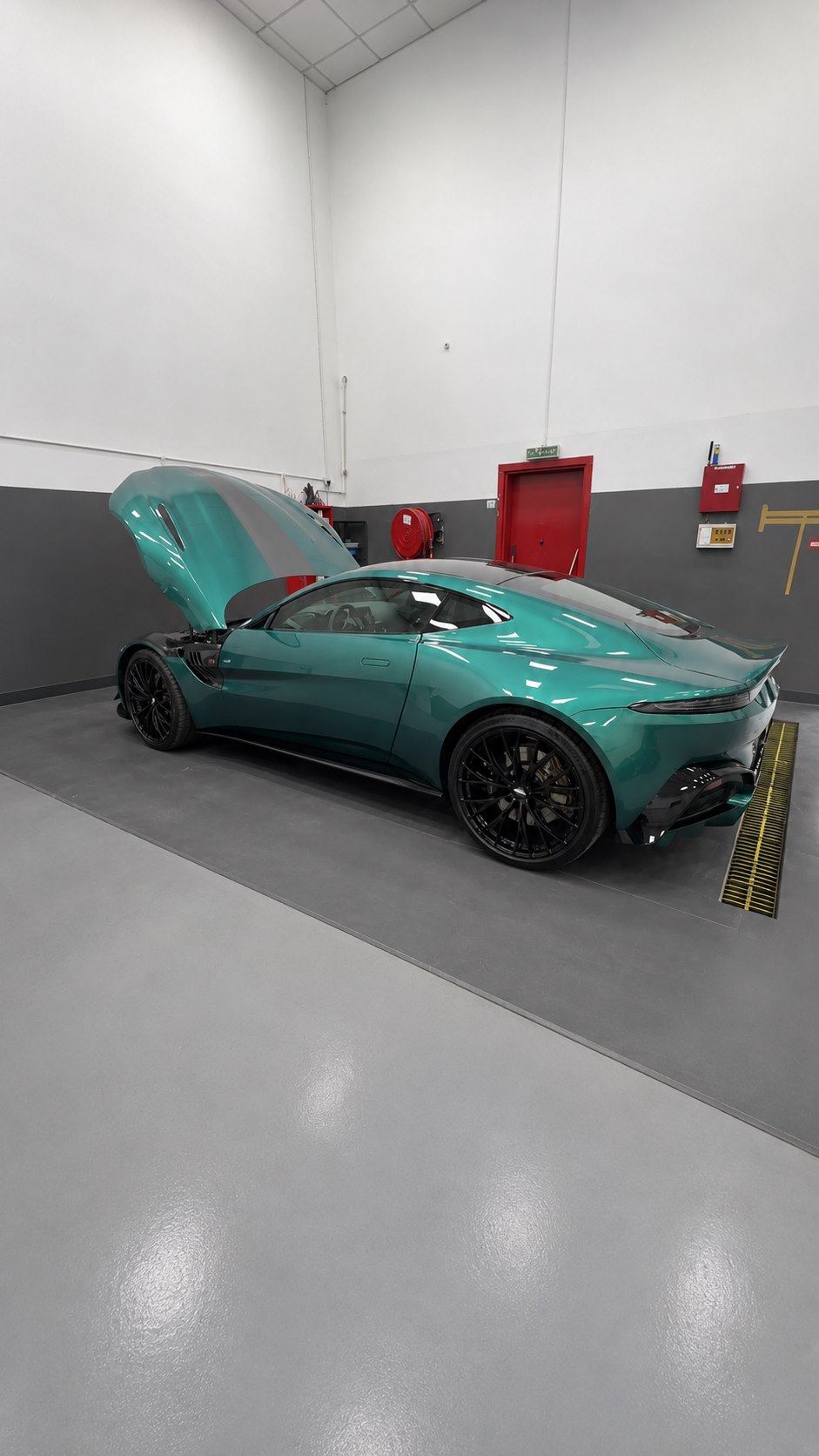 Aston Martin Vantage undergoing inspection at Digi-Tec workshop in Dubai